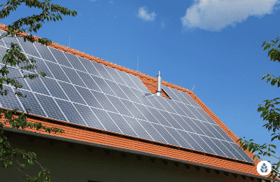 solar panels on a brick tile house roof