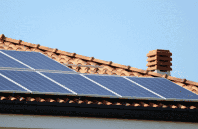 solar panels on a rooftop with chimney